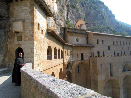 monk standing in monastery in Subiaco, Italy